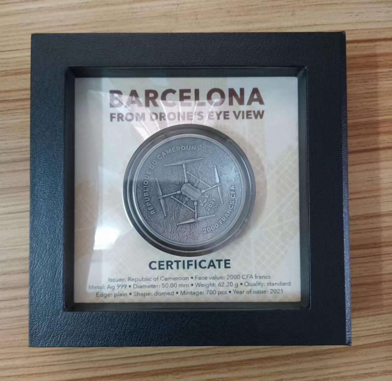 第185期拍卖 【龙头币,2盎司新无人机迷宫系列】喀麦隆2021年，无人机之下-巴萨罗那迷宫，2盎司加大(直径达50mm)、正反高深凹凸曲弧面穹顶形(半球面形),高浮雕仿古银币. 盒证全. 迷宫热门银币. 国外原售价316美元