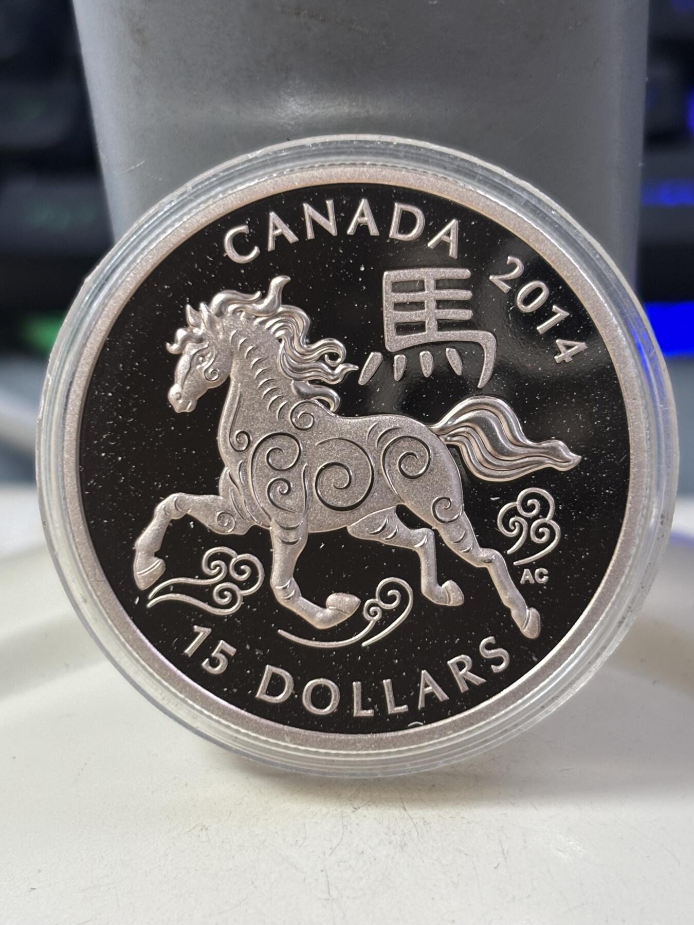 第185期拍卖 加拿大2014年生肖马年1盎司纪念银币，999银，塑料盒有裂痕，银价465元