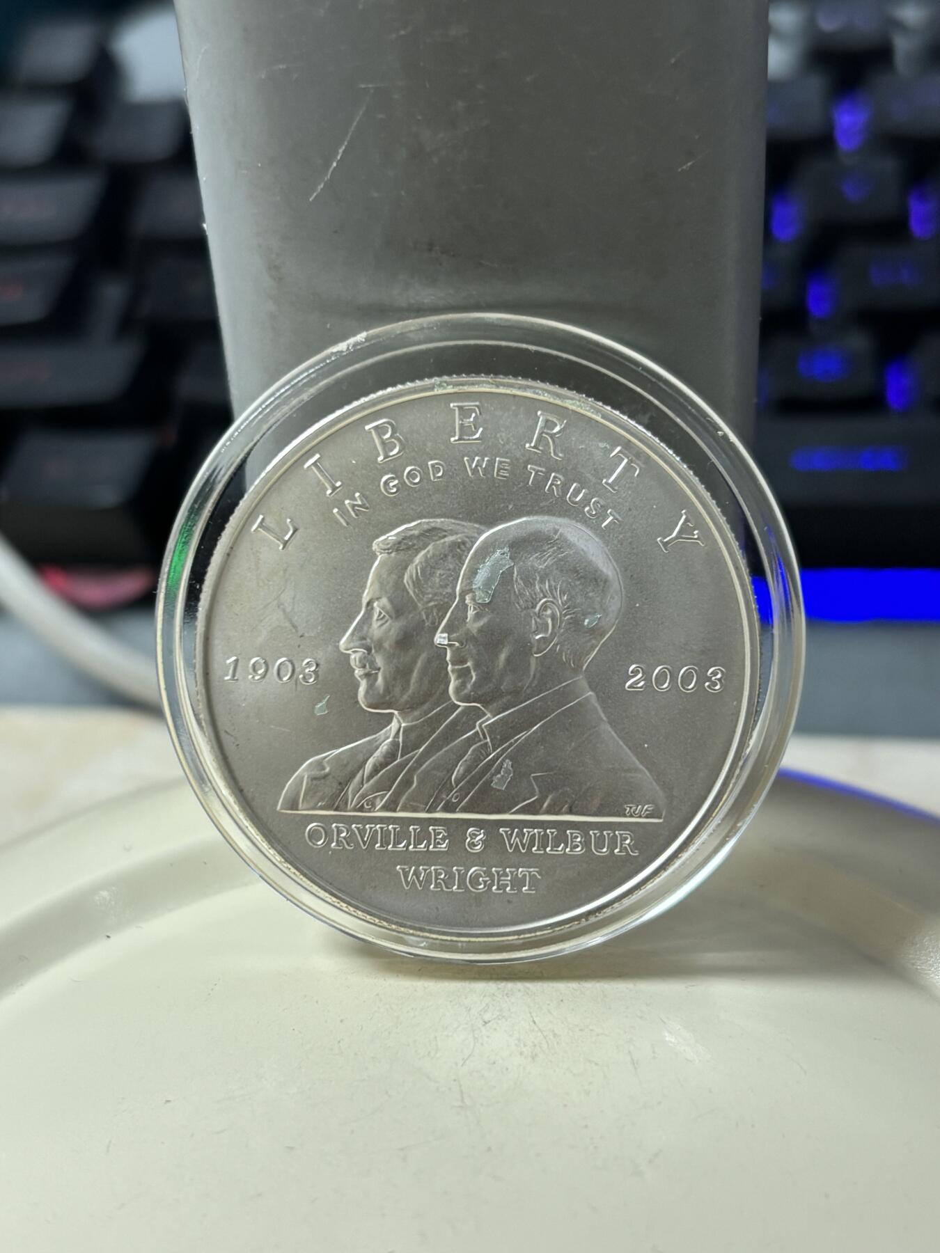 第185期拍卖 美国2003年人类首飞莱特兄弟磨砂版银币，900银，26.72克，银价360
