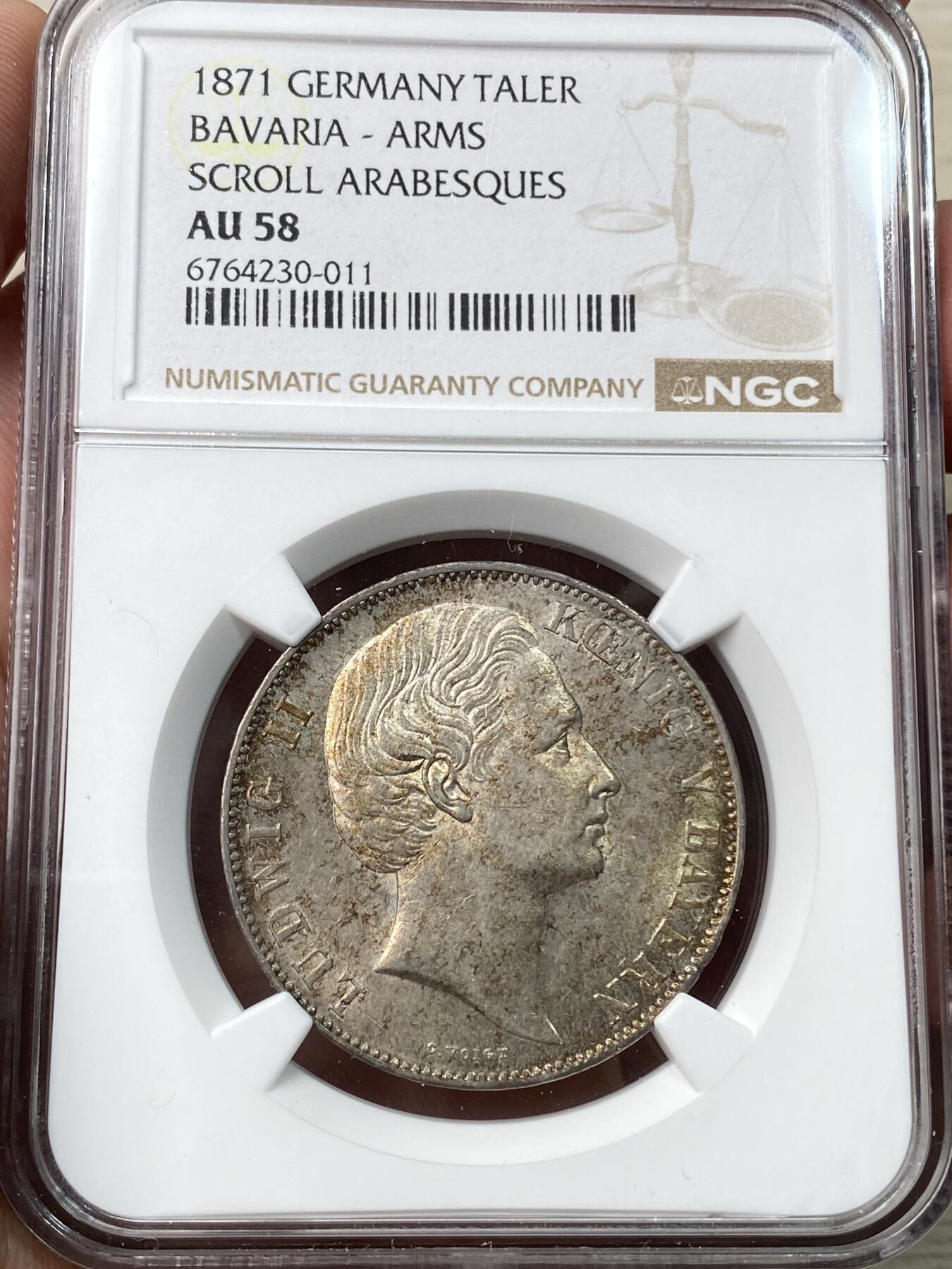 万国钱币拍卖第058期（万国新年大拍） NGC AU58 1871年德国巴伐利亚路德维希二世双狮护盾流通泰勒 路二双狮大难点 罕见的J.Ries版胜利泰勒头像 区别之前的G.Voigt版头像 原味金彩包浆极美 欧拍价格居高不下的名誉品种