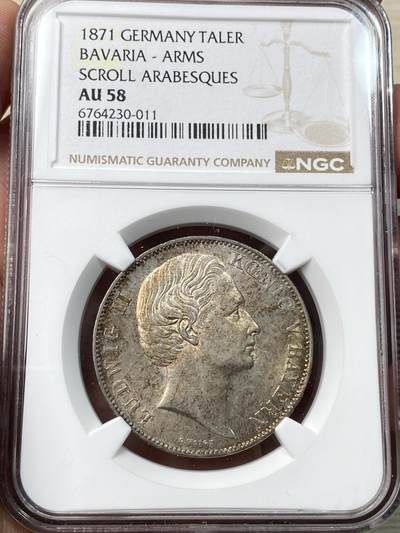 万国钱币拍卖第058期（万国新年大拍） - NGC AU58 1871年德国巴伐利亚路德维希二世双狮护盾流通泰勒 路二双狮大难点 罕见的J.Ries版胜利泰勒头像 区别之前的G.Voigt版头像 原味金彩包浆极美 欧拍价格居高不下的名誉品种