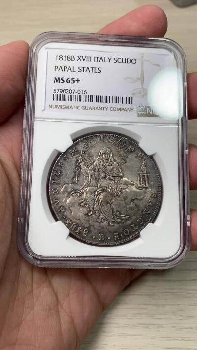 万国钱币拍卖第058期（万国新年大拍） NGC MS65+ 1818年梵蒂冈教皇国皮乌斯七世斯库多大银 博洛尼亚造币厂铸 极其难得的GEM级早期教皇国大银 圣母玛利亚端坐云中 手持缩小版的圣彼得宗座圣殿与打开圣门的钥匙  丝绸转光底板原味欧陆五彩 一步到位的入库级藏品 NGC唯一亚军分 更高分仅一枚