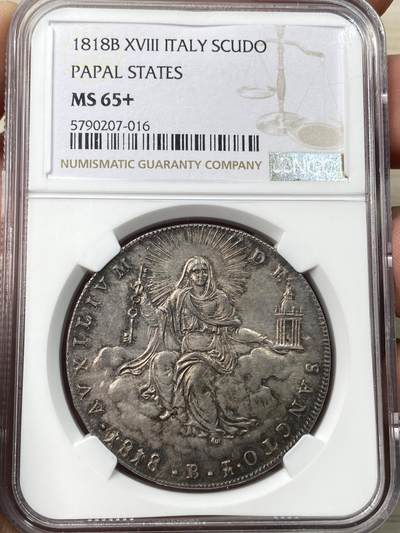 万国钱币拍卖第058期（万国新年大拍） NGC MS65+ 1818年梵蒂冈教皇国皮乌斯七世斯库多大银 博洛尼亚造币厂铸 极其难得的GEM级早期教皇国大银 圣母玛利亚端坐云中 手持缩小版的圣彼得宗座圣殿与打开圣门的钥匙  丝绸转光底板原味欧陆五彩 一步到位的入库级藏品 NGC唯一亚军分 更高分仅一枚