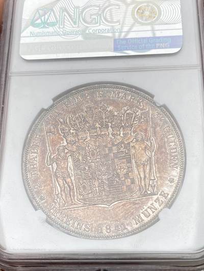 万国钱币拍卖第058期（万国新年大拍） NGC AU58 1841年德国施瓦茨堡-桑德斯豪森野人流通2泰勒 邦国时期2泰勒代表之作 独特的纹章设计令人过目难忘 因发行量稀少想入藏一枚好品难度极大 双面原味火烧云晚霞包浆 高点细节极佳