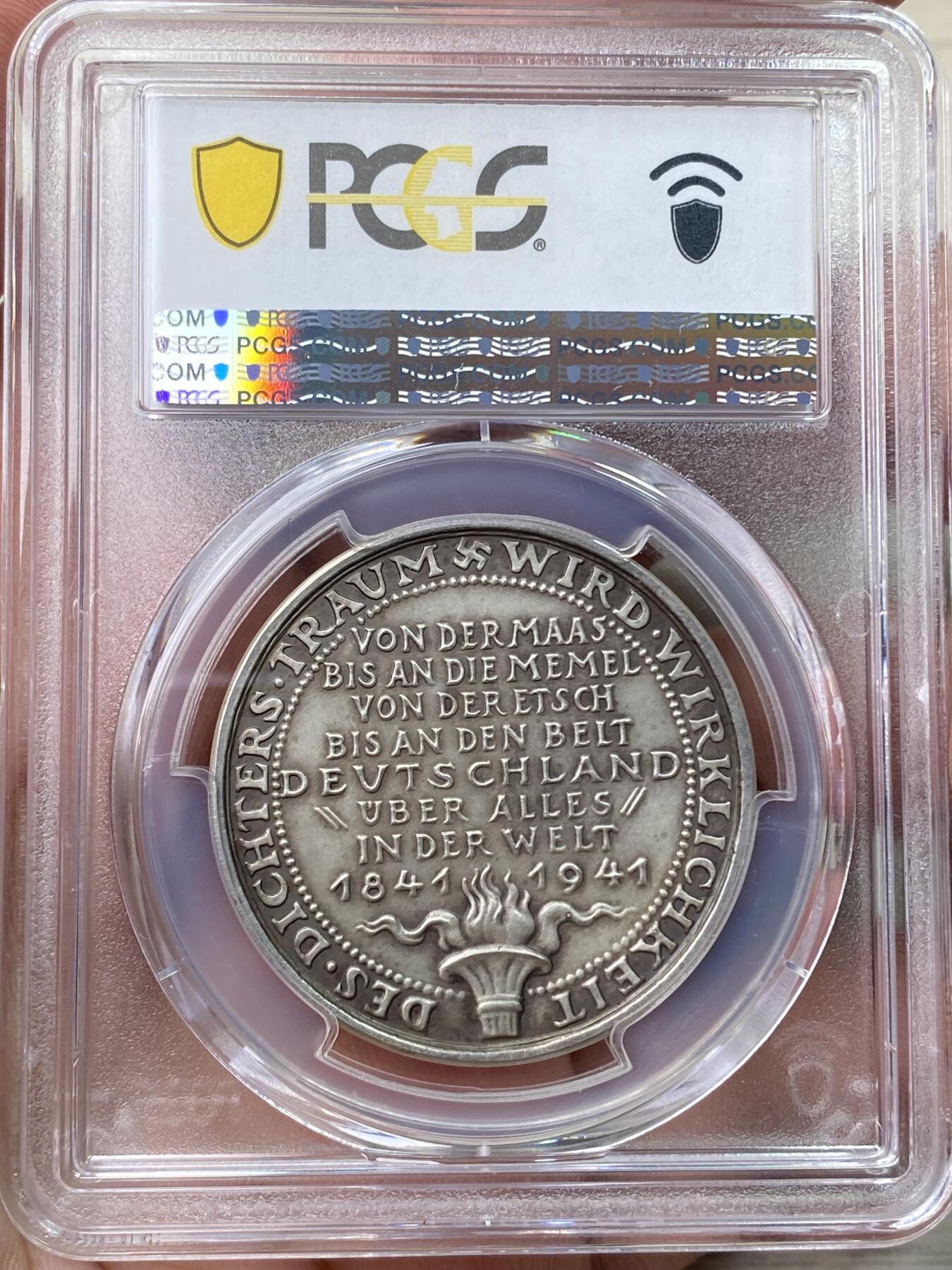 万国钱币拍卖第058期（万国新年大拍） PCGS SP63 1941年德国民族社会主义工人党纪念创作德国国歌诗人奥古斯特·海因里希·霍夫曼·冯·法勒斯莱本诞辰100周年银章 哥茨设计罕见品种 全磨砂人物刻画伟岸细腻 PC唯一冠军