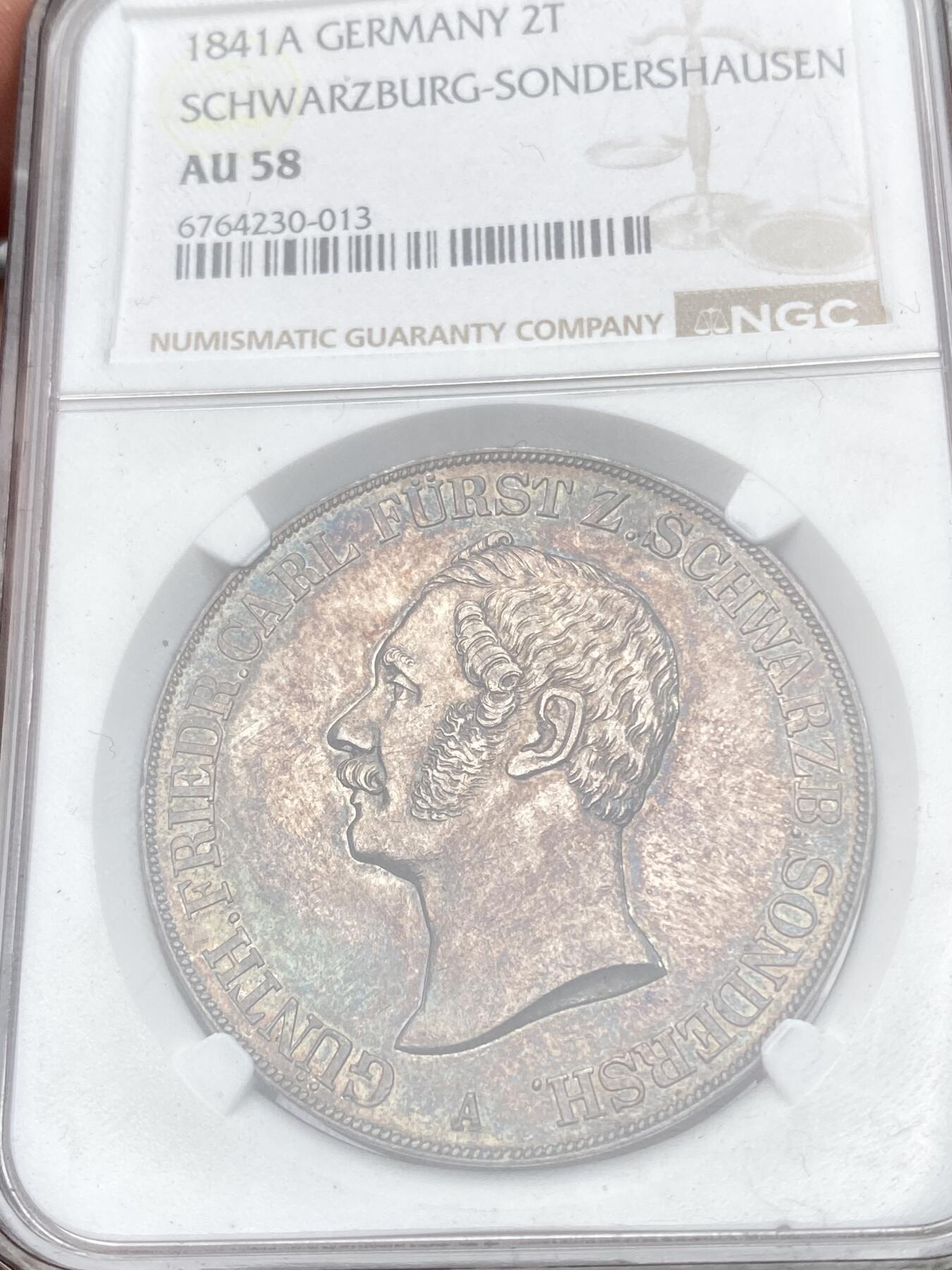 万国钱币拍卖第058期（万国新年大拍） NGC AU58 1841年德国施瓦茨堡-桑德斯豪森野人流通2泰勒 邦国时期2泰勒代表之作 独特的纹章设计令人过目难忘 因发行量稀少想入藏一枚好品难度极大 双面原味火烧云晚霞包浆 高点细节极佳