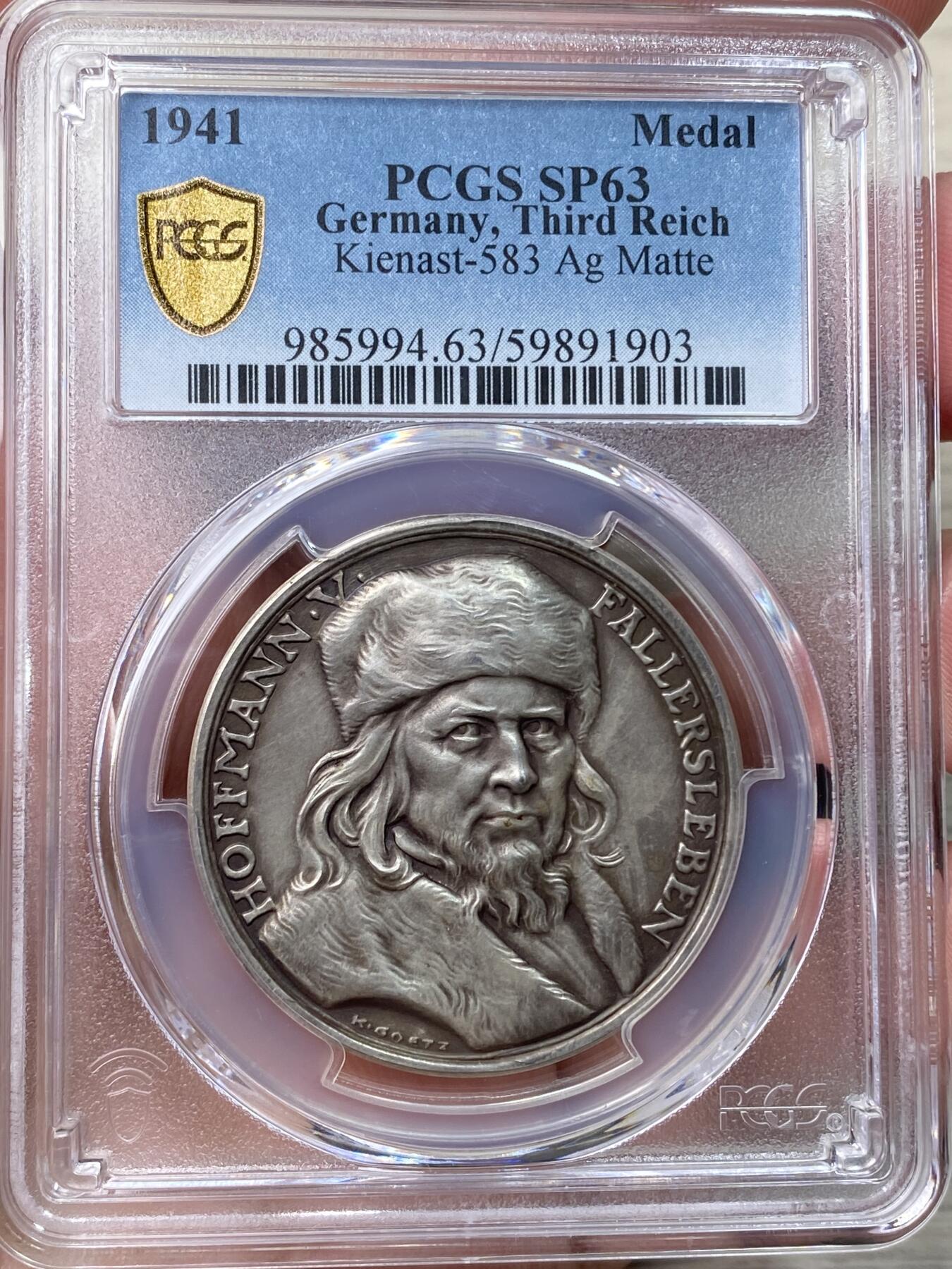 万国钱币拍卖第058期（万国新年大拍） PCGS SP63 1941年德国民族社会主义工人党纪念创作德国国歌诗人奥古斯特·海因里希·霍夫曼·冯·法勒斯莱本诞辰100周年银章 哥茨设计罕见品种 全磨砂人物刻画伟岸细腻 PC唯一冠军