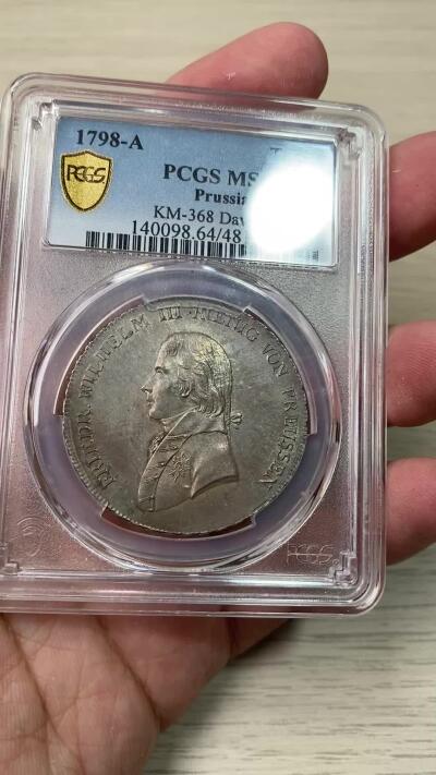 万国钱币拍卖第058期（万国新年大拍） PCGS MS64 1798年德国普鲁士威廉三世野人护盾流通大泰勒 普鲁士名品之一 均匀德式五彩 打制周正  威三胸前勋章以及野人重点部位的高点极其出色 一步到位的典藏级品质 PCGS冠军分