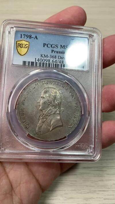 万国钱币拍卖第058期（万国新年大拍） PCGS MS64 1798年德国普鲁士威廉三世野人护盾流通大泰勒 普鲁士名品之一 均匀德式五彩 打制周正  威三胸前勋章以及野人重点部位的高点极其出色 一步到位的典藏级品质 PCGS冠军分