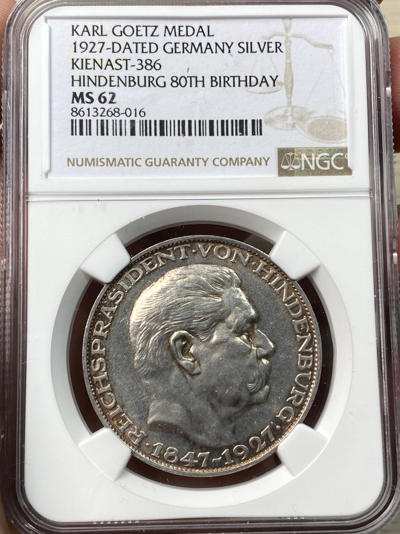 万国钱币拍卖第058期（万国新年大拍） NGC MS62 1927年无D德国魏玛共和国兴登堡总统80大寿5马克币章 极其罕见的无D版 环彩收藏级