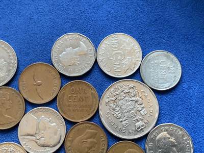 《竞宝斋》第449场 周日，周一，周二  3场连拍 （全场包邮，欢迎送拍） 25枚一组 瑞士，美国，加拿大钱币，包含一枚瑞士5法郎，加拿大50分，4枚麦穗1美分和1枚战时钢制1美分，细节见图。