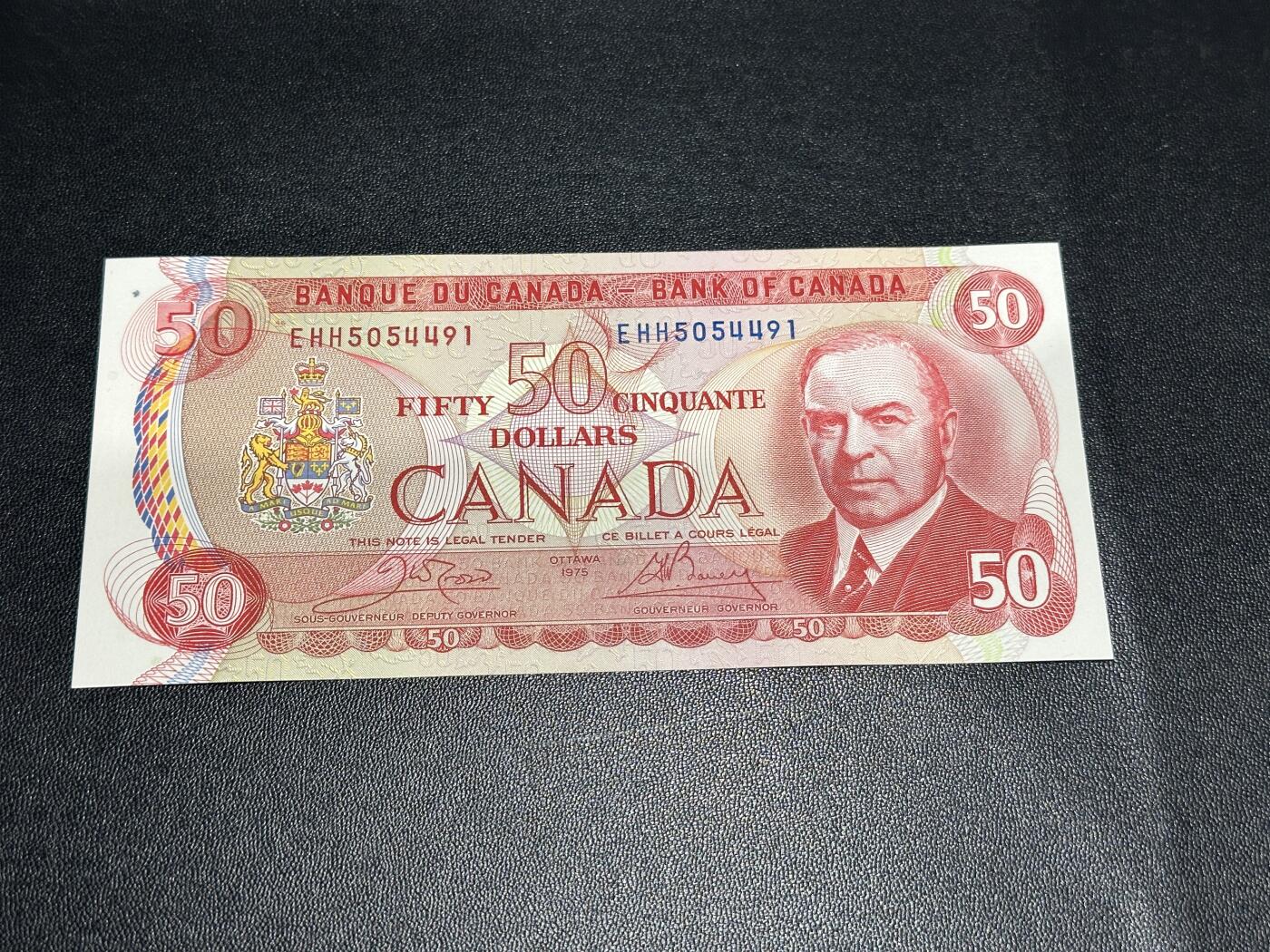 《外钞收藏家》第五百九十六期（精品大拍场）（本平台长期征集拍品、欢迎藏友们联系合作） 加拿大1975年景观版系列50元（背面是经典皇家骑警）全新不绝 有个斑