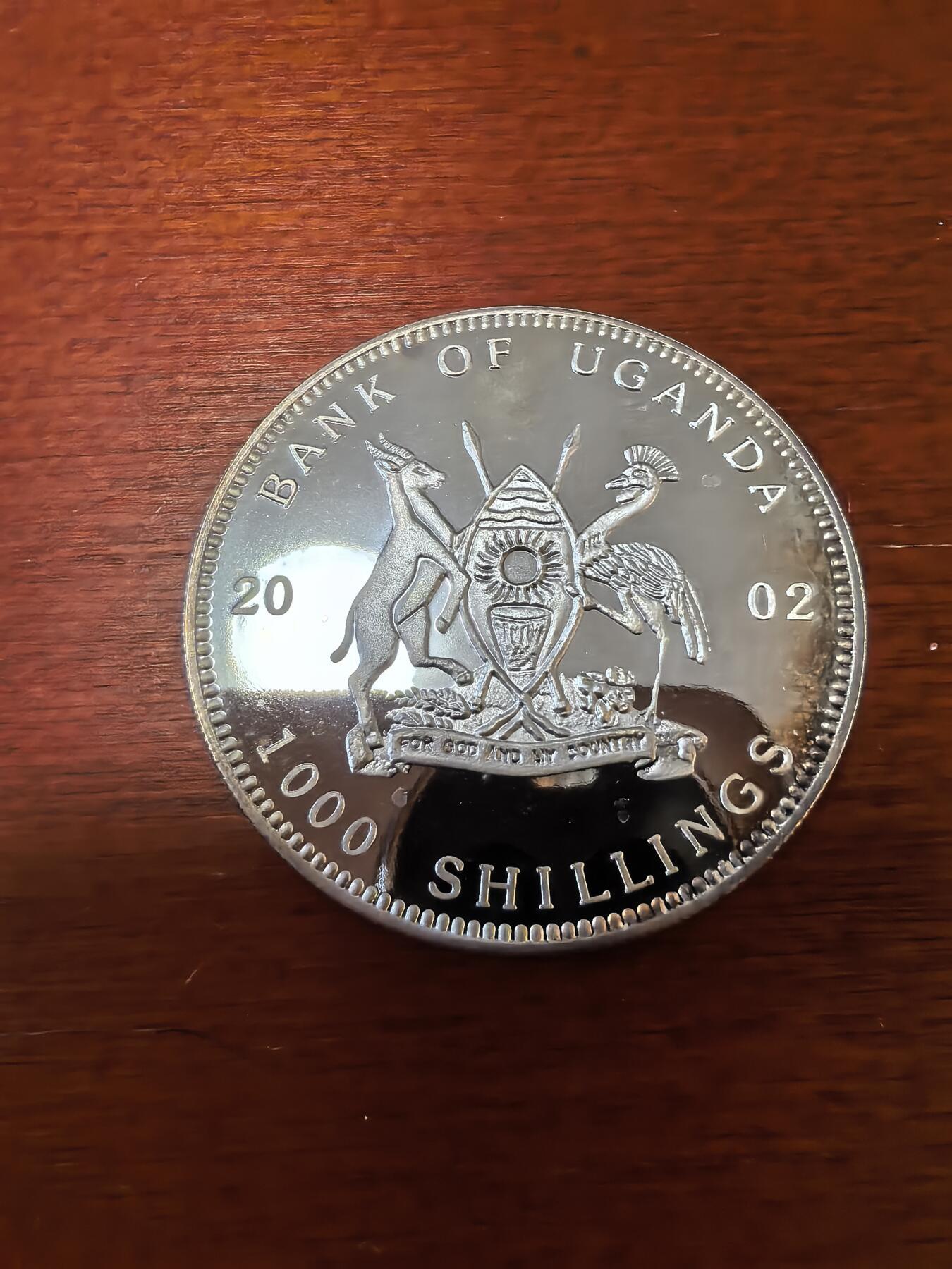长老汇蛇年精选第八十五场拍卖  2002乌干达教皇保罗二世1000先令铜镀银精制币，克书未记载