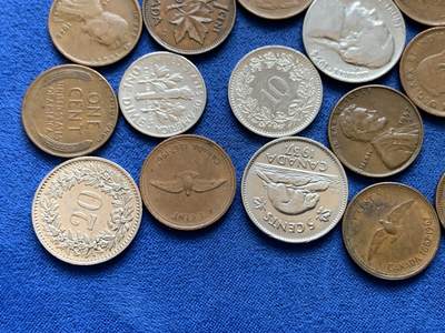 《竞宝斋》第449场 周日，周一，周二  3场连拍 （全场包邮，欢迎送拍） 25枚一组 瑞士，美国，加拿大钱币，包含一枚瑞士5法郎，加拿大50分，4枚麦穗1美分和1枚战时钢制1美分，细节见图。