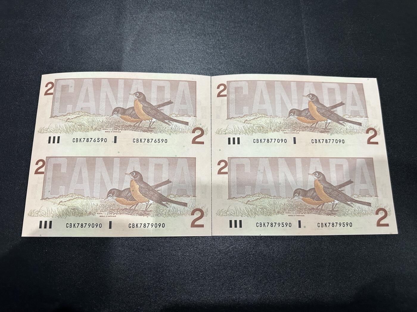 《外钞收藏家》第五百九十六期（精品大拍场）（本平台长期征集拍品、欢迎藏友们联系合作） 加拿大1986年鸟版2元两连体一对（全程无4；号码不错）	UNC  有一张有轻微潮点