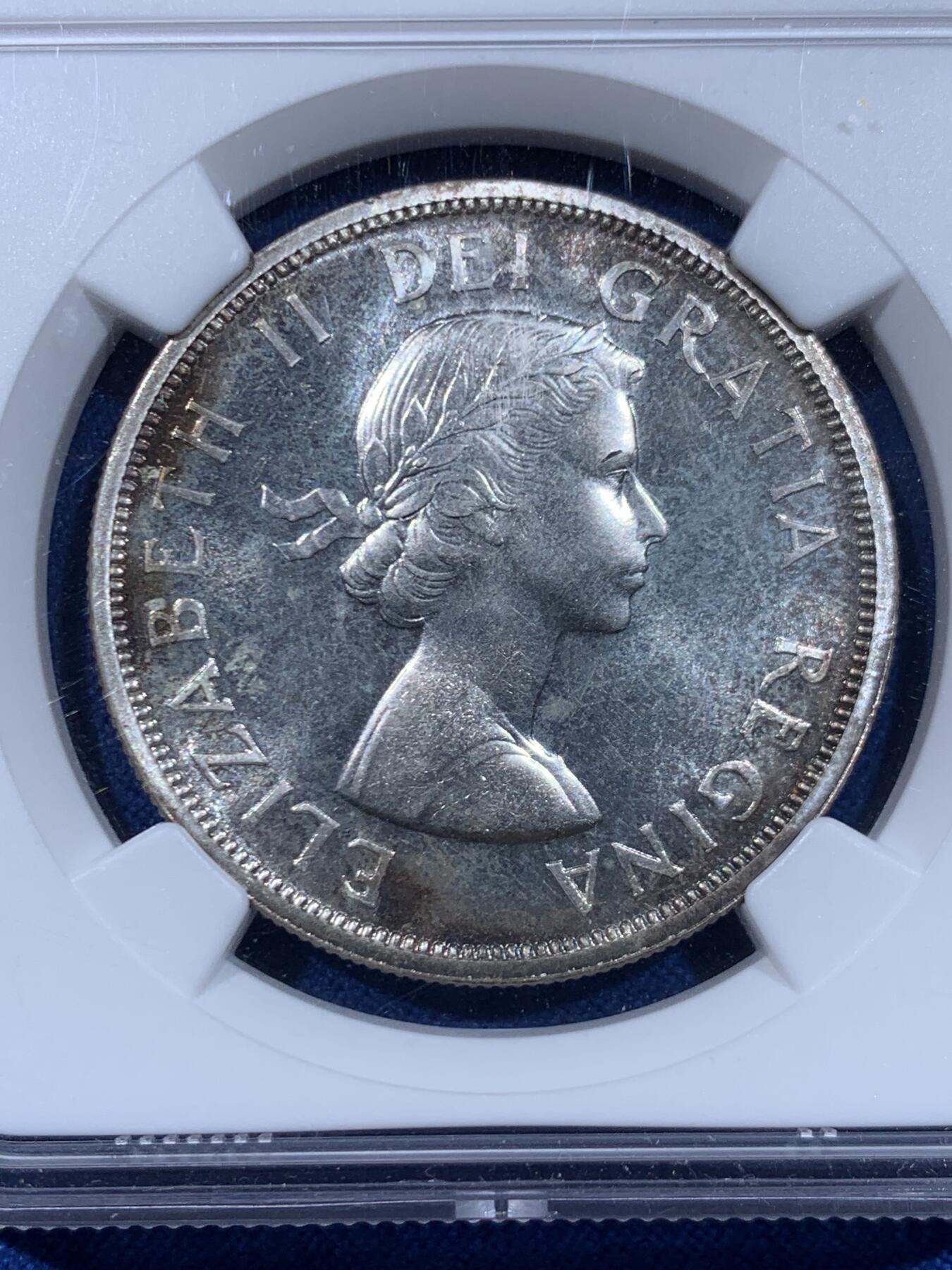 《竞宝斋》第450场 周日，周一，周二  3场连拍 （全场包邮，欢迎送拍） NGC PL65 加拿大1959年小伊1元划船大银币，环彩，飘带青年头像伊伊，195x年初版年轻头像，远比196x的版本少的多。女王首版主币大银，PL镜面感十足