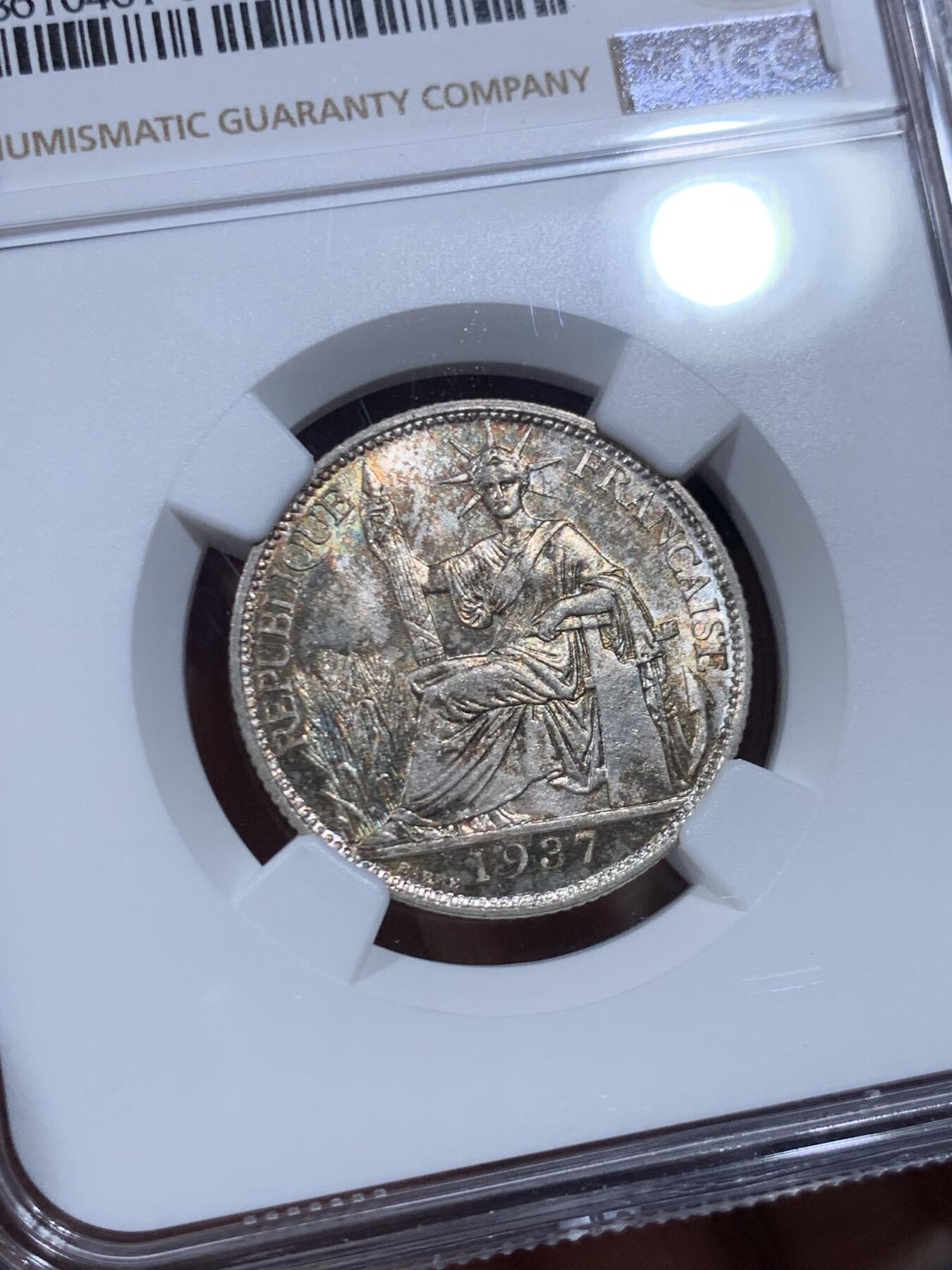 《竞宝斋》第450场 周日，周一，周二  3场连拍 （全场包邮，欢迎送拍） NGC MS63 法属印支1937年二十分银币，带漂亮的包浆，经典品种