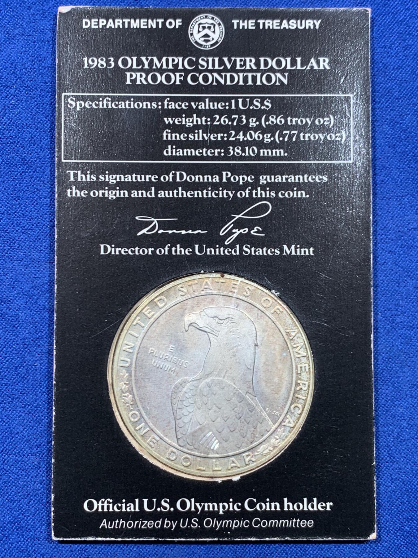 《竞宝斋》第450场 周日，周一，周二  3场连拍 （全场包邮，欢迎送拍） 美国1983年二十三届洛杉矶奥运-掷铁饼者1元 白头鹰大银币 900银 重26.73克 卡装