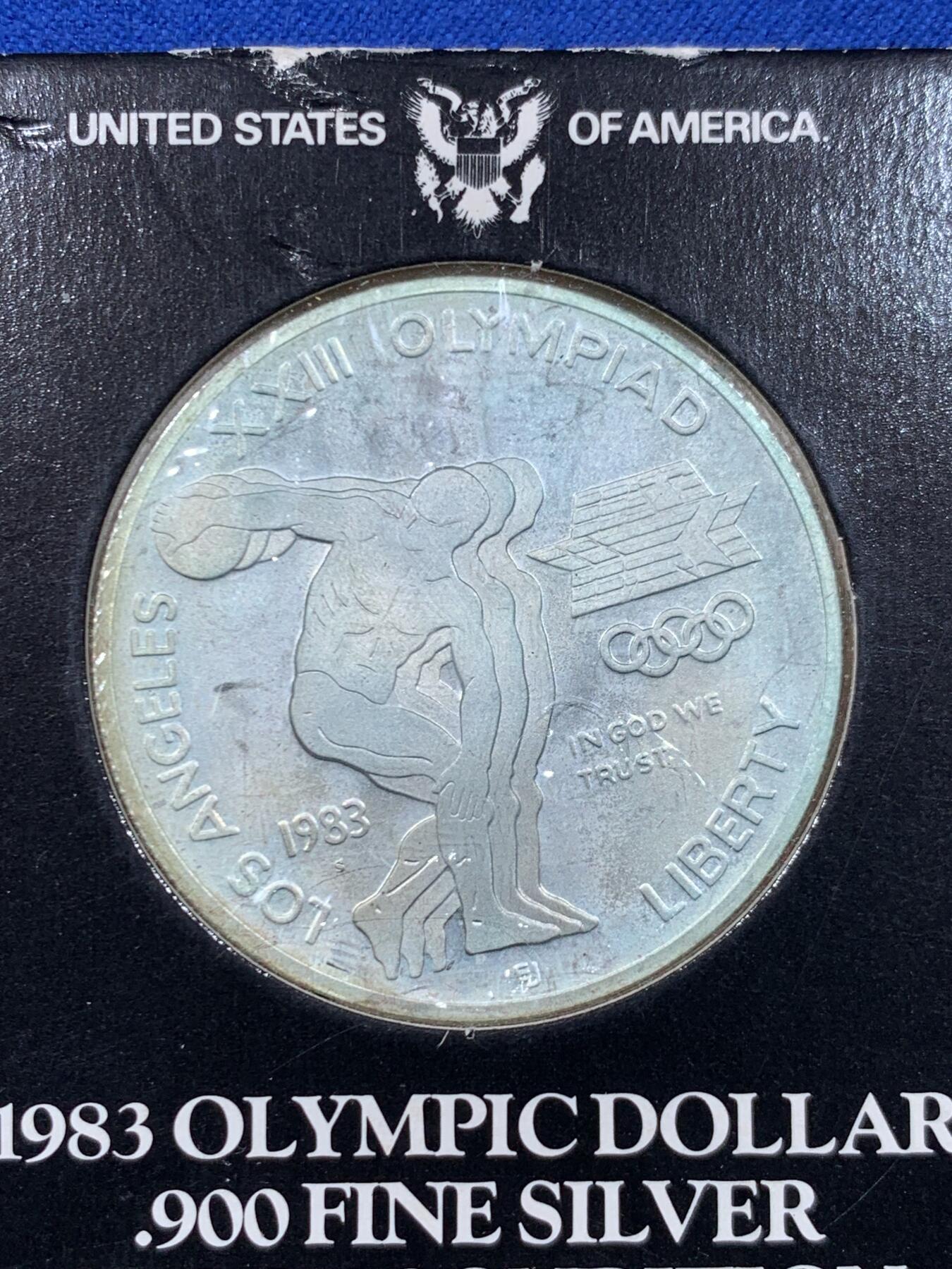 《竞宝斋》第450场 周日，周一，周二  3场连拍 （全场包邮，欢迎送拍） 美国1983年二十三届洛杉矶奥运-掷铁饼者1元 白头鹰大银币 900银 重26.73克 卡装