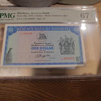 世界钱币～微拍第221期暨2025年第61期  最新货品（群里先挑剩）选购 - 1979年罗德西亚1元 PMG67E尾号908