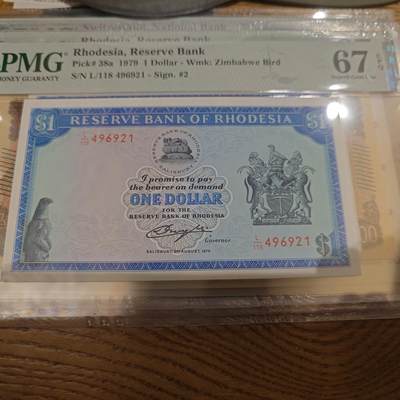 世界钱币～微拍第221期暨2025年第61期  最新货品（群里先挑剩）选购 - 1979年罗德西亚1元 PMG67E尾号921