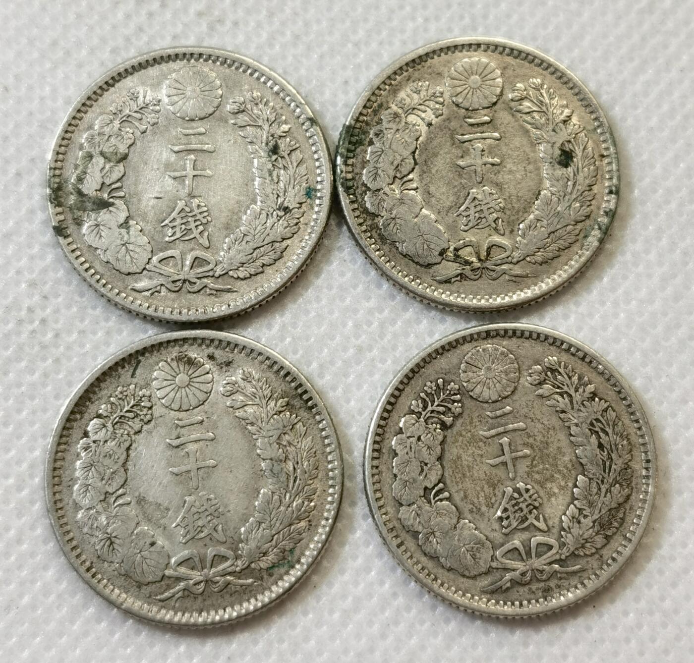 甄臻铺-世界币章拍卖（第45期）精品场拍品征集中，送拍享返佣金等优惠多多 日本明治龙20钱4枚 多年份 21.4克 含银80% 纯银价260