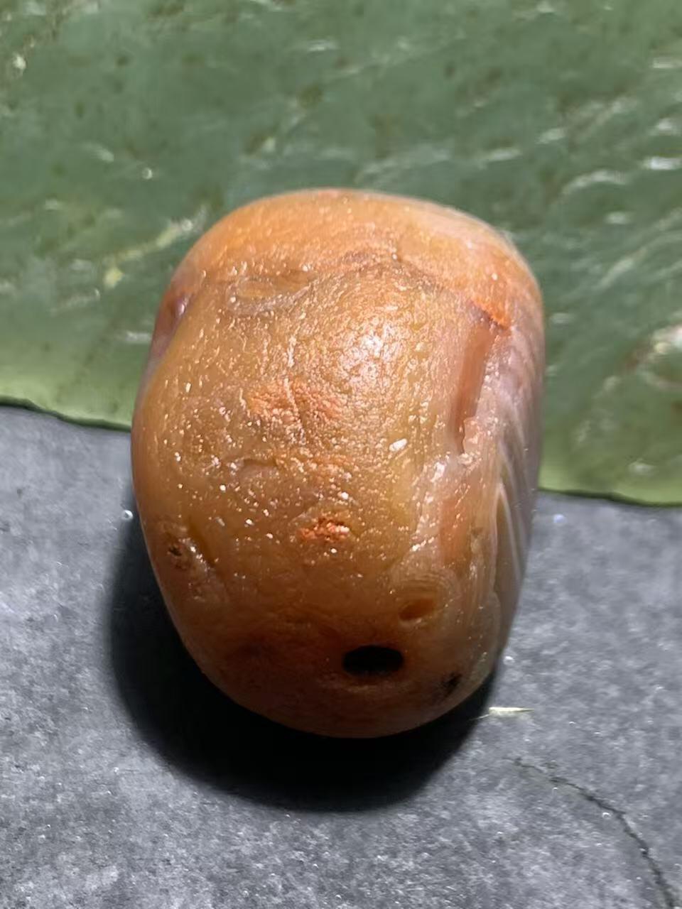 精美红白天眼千层纹水冲籽川料南红玛瑙原石一颗