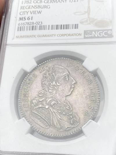 万国钱币拍卖第058期（万国新年大拍） NGC MS61 1782年德国雷根斯堡自由市景观1/2泰勒  后期版头像 全深打景观极其难得 高点细节极佳 原味欧陆包浆收藏级