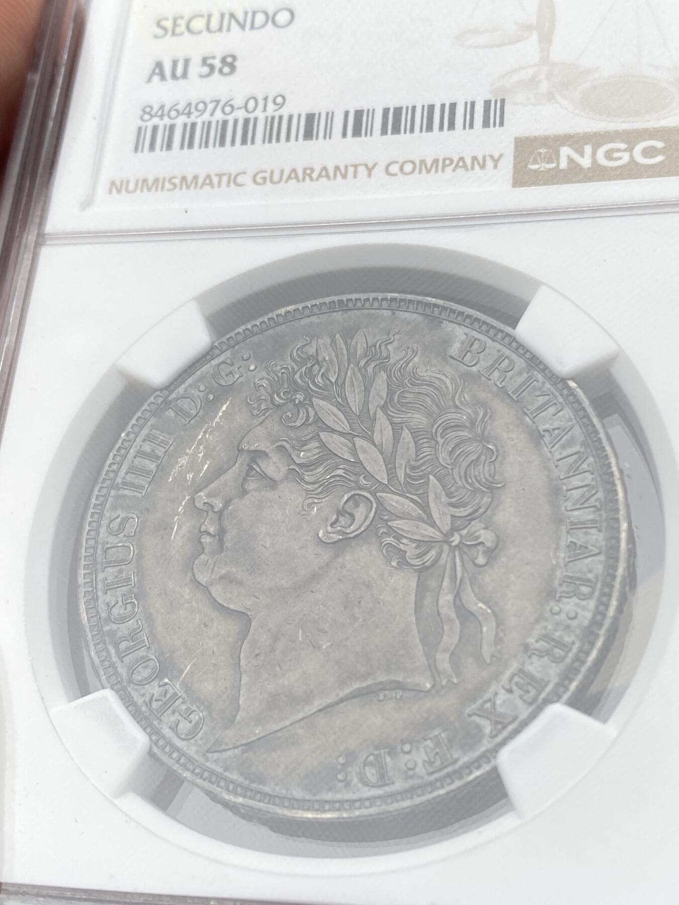 万国钱币拍卖第058期（万国新年大拍） NGC AU58 1821年SECUNDO英国乔治四世马剑克朗 英国马剑系列中的名誉品种 Pistrucci倾力之作 浓郁酱彩 高点极佳