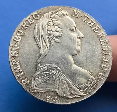 外国优质老铜币高银银币，周六九点倒数截拍，满百包邮，持续收拍 - 奥地利玛丽亚・特蕾西亚大银币，关联 18 世纪神圣罗马帝国。正面女王肖像端庄，背面双鹰徽章尽显哈布斯堡王朝威严。银币工艺精湛，细节饱满，承载帝国兴衰史，曾跨洲流通。它是王室权柄象征，兼具艺术与历史价值，收藏界经典。岁月包浆添厚重，对王朝史、钱币爱好者而言，是触碰 18 世纪欧陆风云的珍贵载体，历史厚重与艺术美感交融，稀缺性与文化价值兼具 。