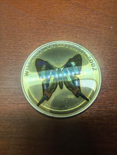 长老汇蛇年精选第八十七场拍卖 - 2002刚果非洲珍稀蝴蝶之多彩雨燕蝴蝶10法郎全息幻彩精制银币，25.95克925银，1.5万枚，克书65美金