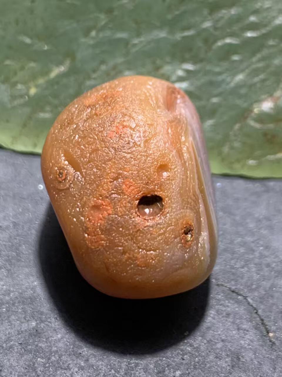 精美红白天眼千层纹水冲籽川料南红玛瑙原石一颗