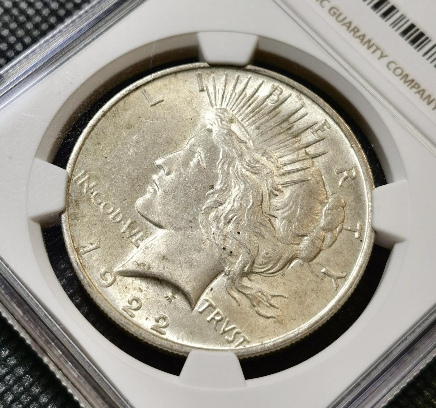 甄臻铺-世界币章拍卖（第45期）精品场拍品征集中，送拍享返佣金等优惠多多 NGC-MS64 美国1922年和平一元银币，双面淡黄油包浆，原光好品