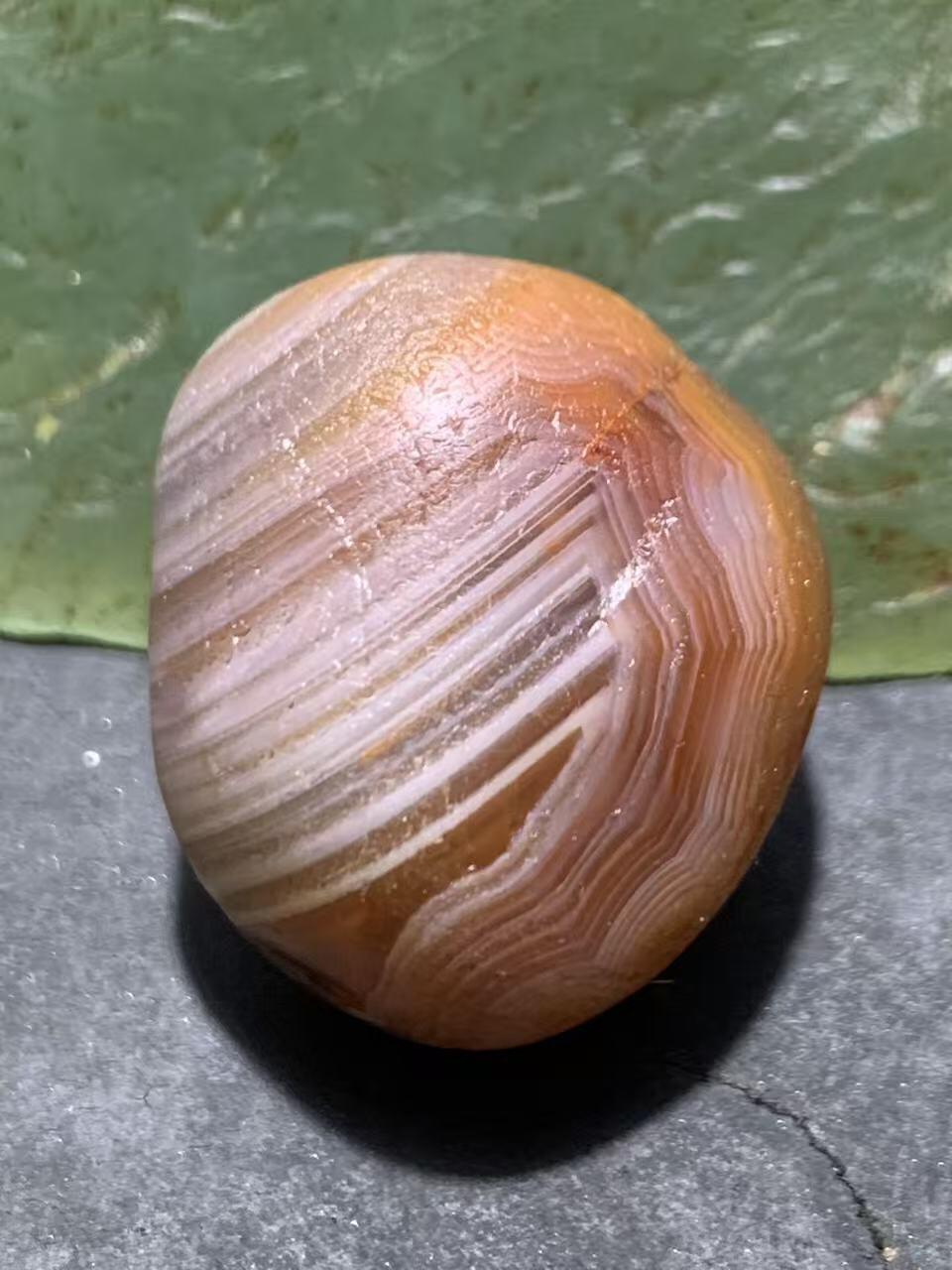 精美红白天眼千层纹水冲籽川料南红玛瑙原石一颗