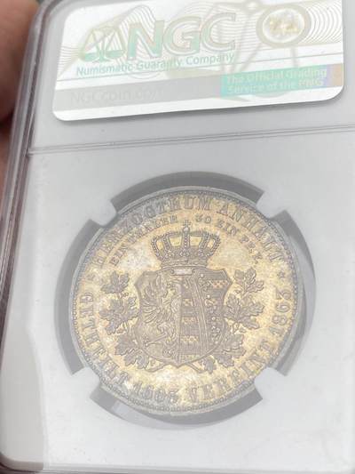 万国钱币拍卖第058期（万国新年大拍） NGC MS66 1863年德国安哈尔特-德邵建国260周年纪念泰勒 欧陆七色祥云幻彩 无可比拟的状态 完全未动过的顶级典藏品质 NGC亚军分（盒子有缺）