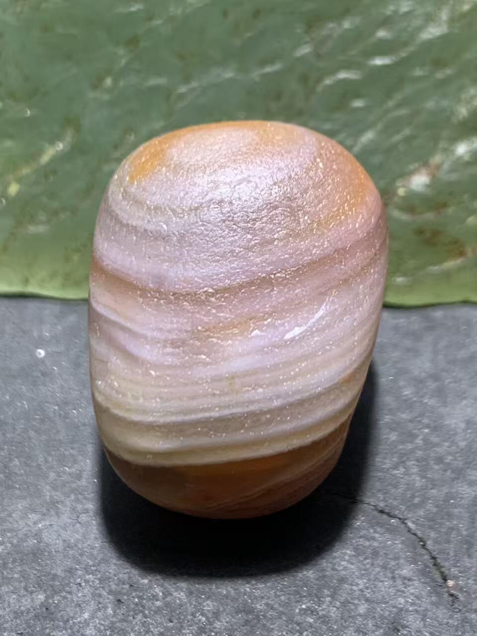 精美红白天眼千层纹水冲籽川料南红玛瑙原石一颗