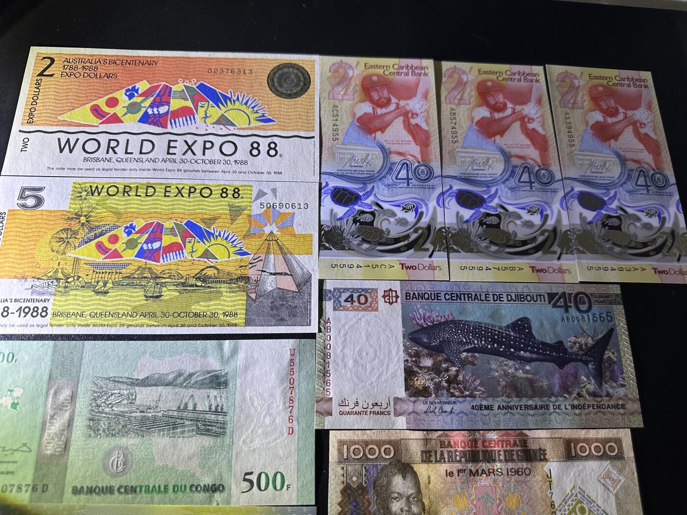 《外钞收藏家》第五百九十七期（年底收官场）（本平台长期征集拍品、欢迎藏友们联系合作） 澳大利亚世博会纪念钞2张（边上轻微潮）+东加勒比纪念钞3张+刚果、几内亚、吉布提、萨摩亚纪念钞共10张一起全新