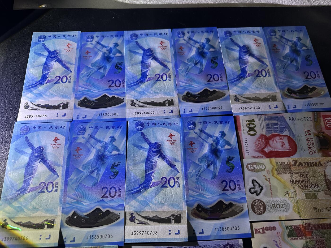 《外钞收藏家》第五百九十七期（年底收官场）（本平台长期征集拍品、欢迎藏友们联系合作） 冬奥会纪念钞5对10张+库克群岛AA和补号+AA冠墨西哥100+利比亚、埃及、赞比亚一起 19张一起 全新UNC