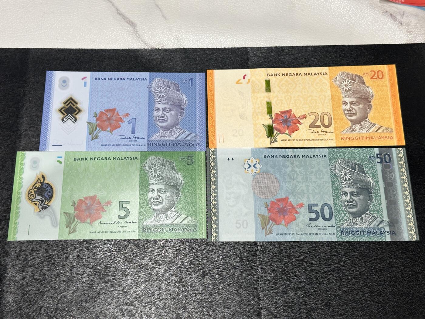 《外钞收藏家》第五百九十七期（年底收官场）（本平台长期征集拍品、欢迎藏友们联系合作） 马来西亚1-50林吉特 四张一起 张一起 全新UNC 号码不错