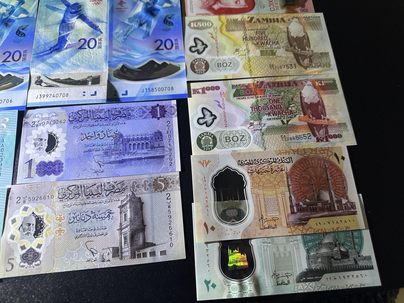 《外钞收藏家》第五百九十七期（年底收官场）（本平台长期征集拍品、欢迎藏友们联系合作） 冬奥会纪念钞5对10张+库克群岛AA和补号+AA冠墨西哥100+利比亚、埃及、赞比亚一起 19张一起 全新UNC