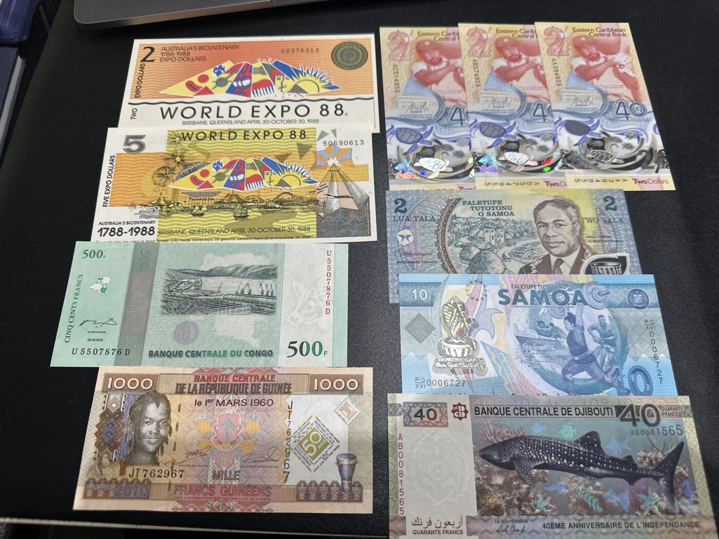 《外钞收藏家》第五百九十七期（年底收官场）（本平台长期征集拍品、欢迎藏友们联系合作） 澳大利亚世博会纪念钞2张（边上轻微潮）+东加勒比纪念钞3张+刚果、几内亚、吉布提、萨摩亚纪念钞共10张一起全新