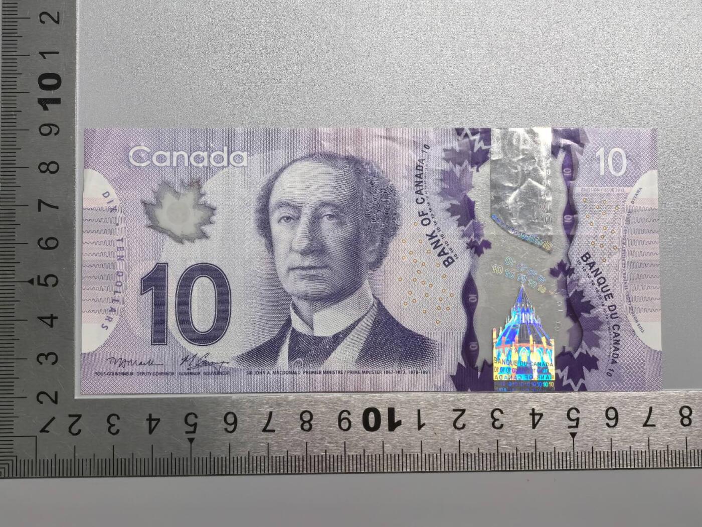 小驴勋章奖章收藏12月27日周六晚六点拍卖（珍爱和平，收藏战争，铭记历史，勿忘国耻，忠党爱国。有偿代拍，送拍规则在简介最后，参拍须阅读规则后再参拍，关系到运费包装发货时效真假辨别等关键信息，拍卖时不再发原图，看大图店主微信码在拍卖店铺介绍里） 加拿大塑料钞10元