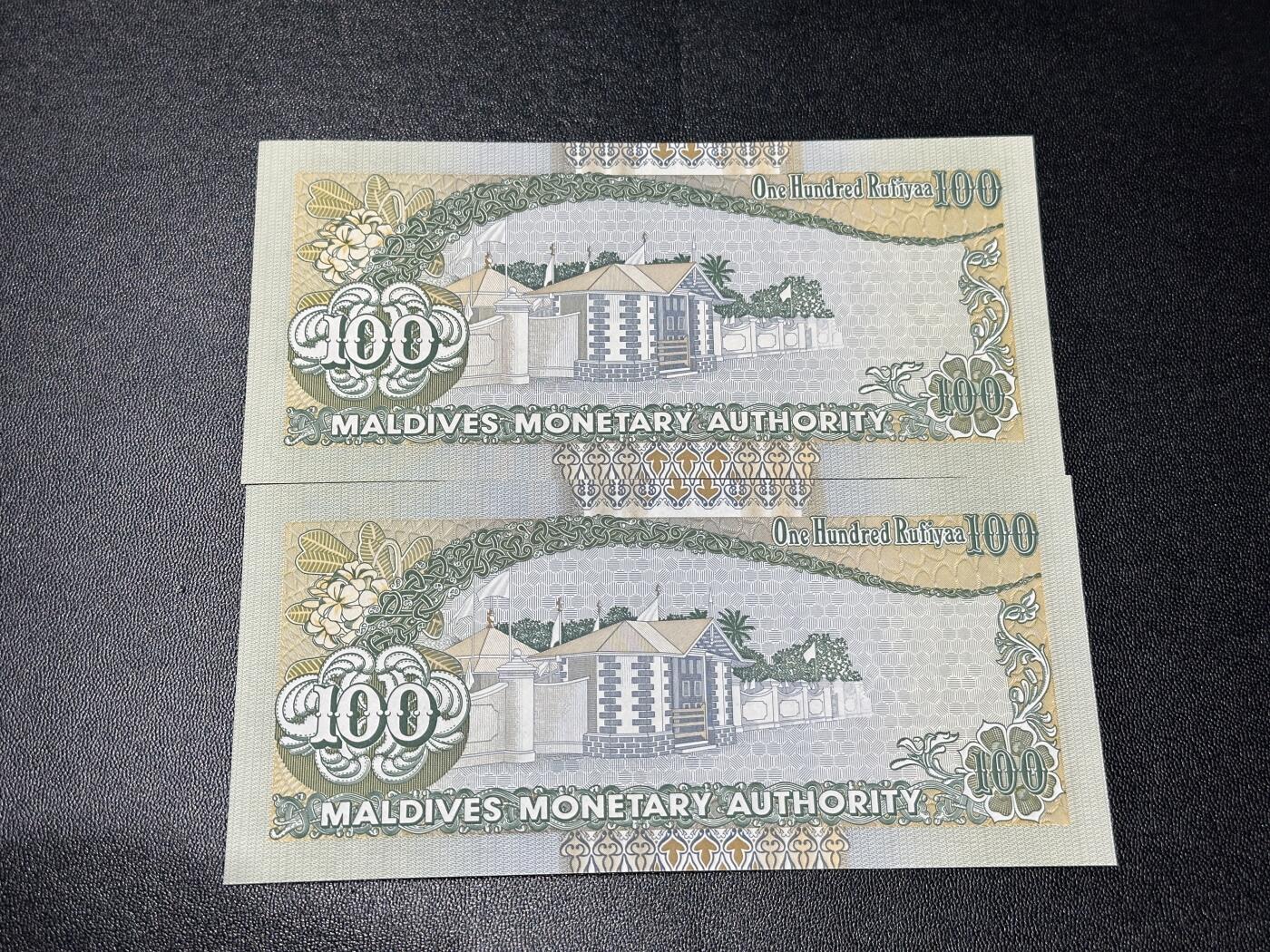 《外钞收藏家》第五百九十七期（年底收官场）（本平台长期征集拍品、欢迎藏友们联系合作） 1995年马尔代夫100 2张一起 全新 有个别不明显荧光点