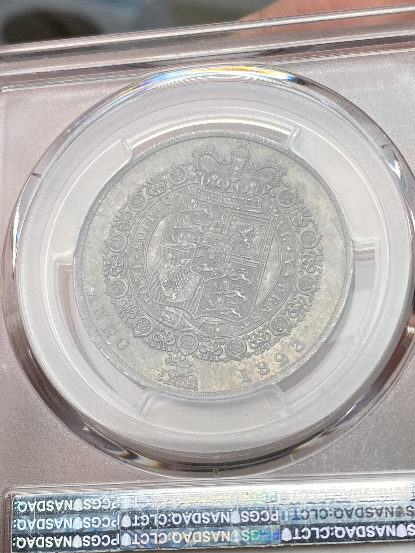 万国钱币拍卖第058期（万国新年大拍） PCGS MS64+ 1823年英国乔治四世嘉德纹章版半克朗银币 嘉德纹章版 乔四流通半克朗中难度最大的一款 PC亚军分 更高分仅一枚 优雅青灰包浆车轮转光 一步到位的典藏级品质