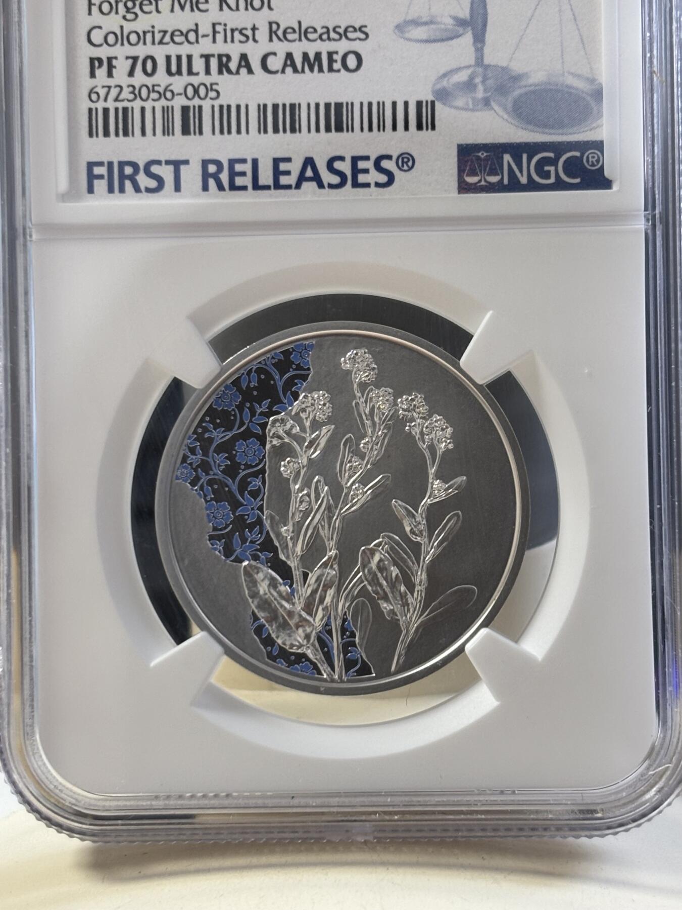 第186期拍卖 盒证齐全奥地利2023年花语系列勿忘我NGC评级首期蓝标70分彩色精制纪念银币