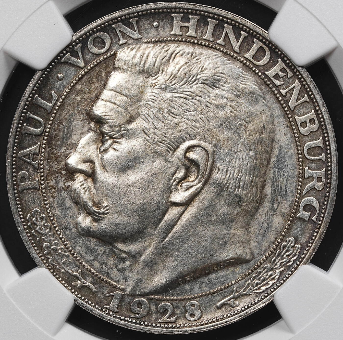 修遠堂世界钱币第九十九期 NGC MS62 1928年兴登堡80大寿纪念银章 伯恩哈特设计制版，明显少于卡尔歌茨版