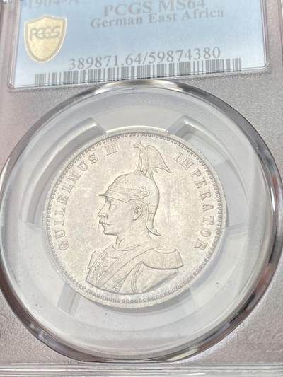 万国钱币拍卖第058期（万国新年大拍） PCGS MS64 1904年德国德属东非威廉二世军装1卢比银币 德属热门品种 丝绸转光幻彩包浆极美收藏级 PC亚军分更高仅一枚