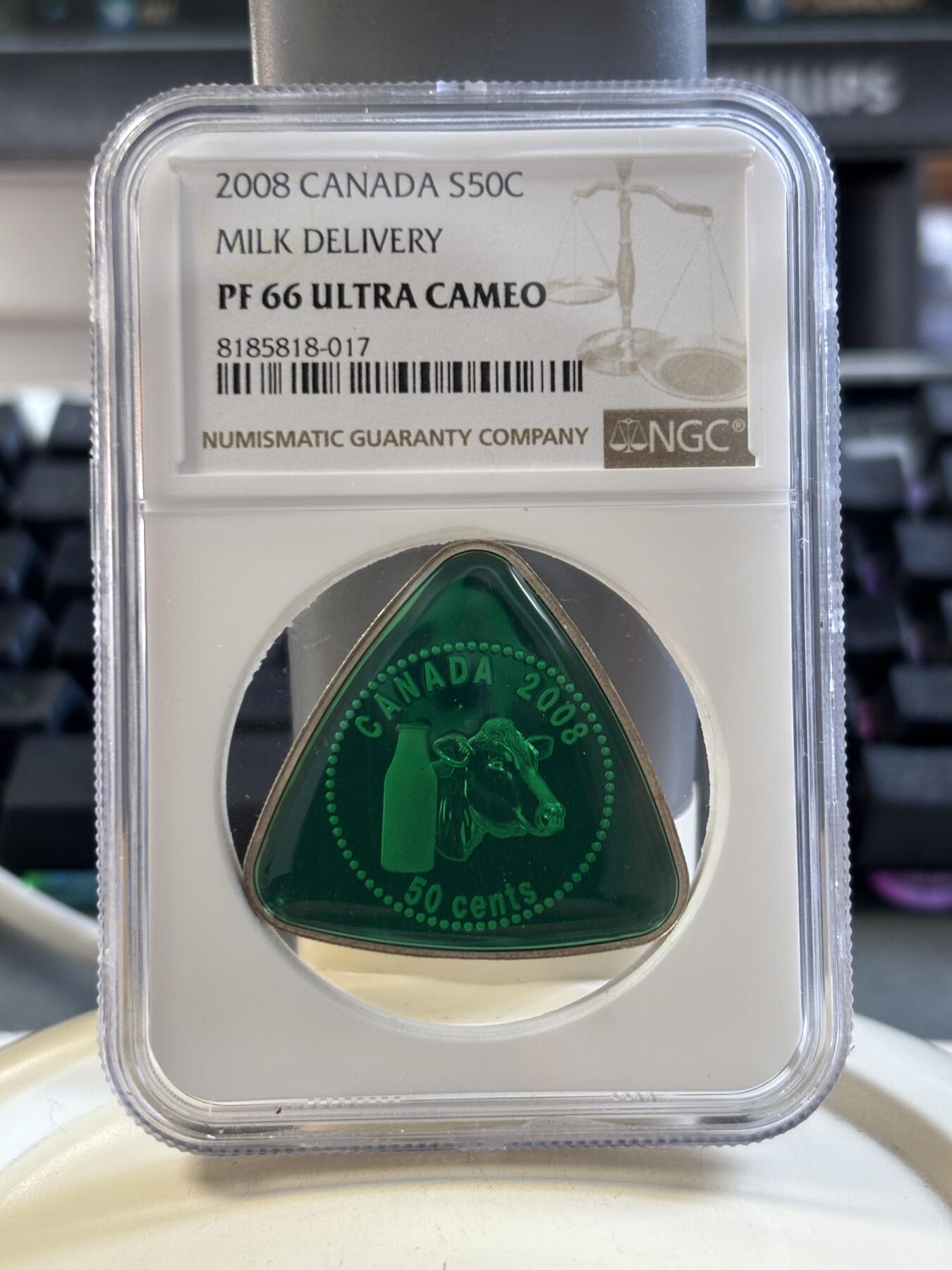 第186期拍卖 加拿大2008年牛奶支付代用币精制三角形纪念银币，20克