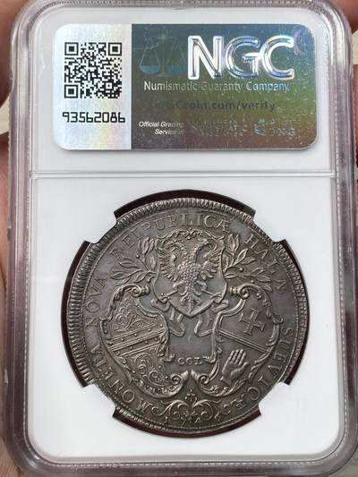 万国钱币拍卖第058期（万国新年大拍） NGC MS63 1746年神圣罗马帝国时期哈尔自由市三盾徽大泰勒 发行量仅800枚的神罗大泰勒 正面人像为时任神罗皇帝的弗朗西斯一世 同时也是玛利亚特蕾莎的丈夫 背面为设计独特的哈尔自由市三盾徽 领先于时代的顶级工艺 高浮雕质感跃然币面 光线下显现出的醇厚玫瑰色调欧陆包浆令人着迷