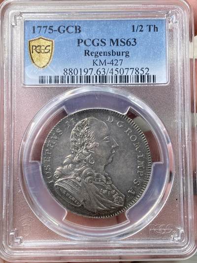 万国钱币拍卖第058期（万国新年大拍） PCGS MS63 1775德国雷根斯堡城市景观1/2泰勒 早期头像版 正面肖像为神罗皇帝约瑟夫二世 背面则是雷根斯堡老城景观 原味欧陆酱五彩 极其难得的品相状态 PC唯一冠军分